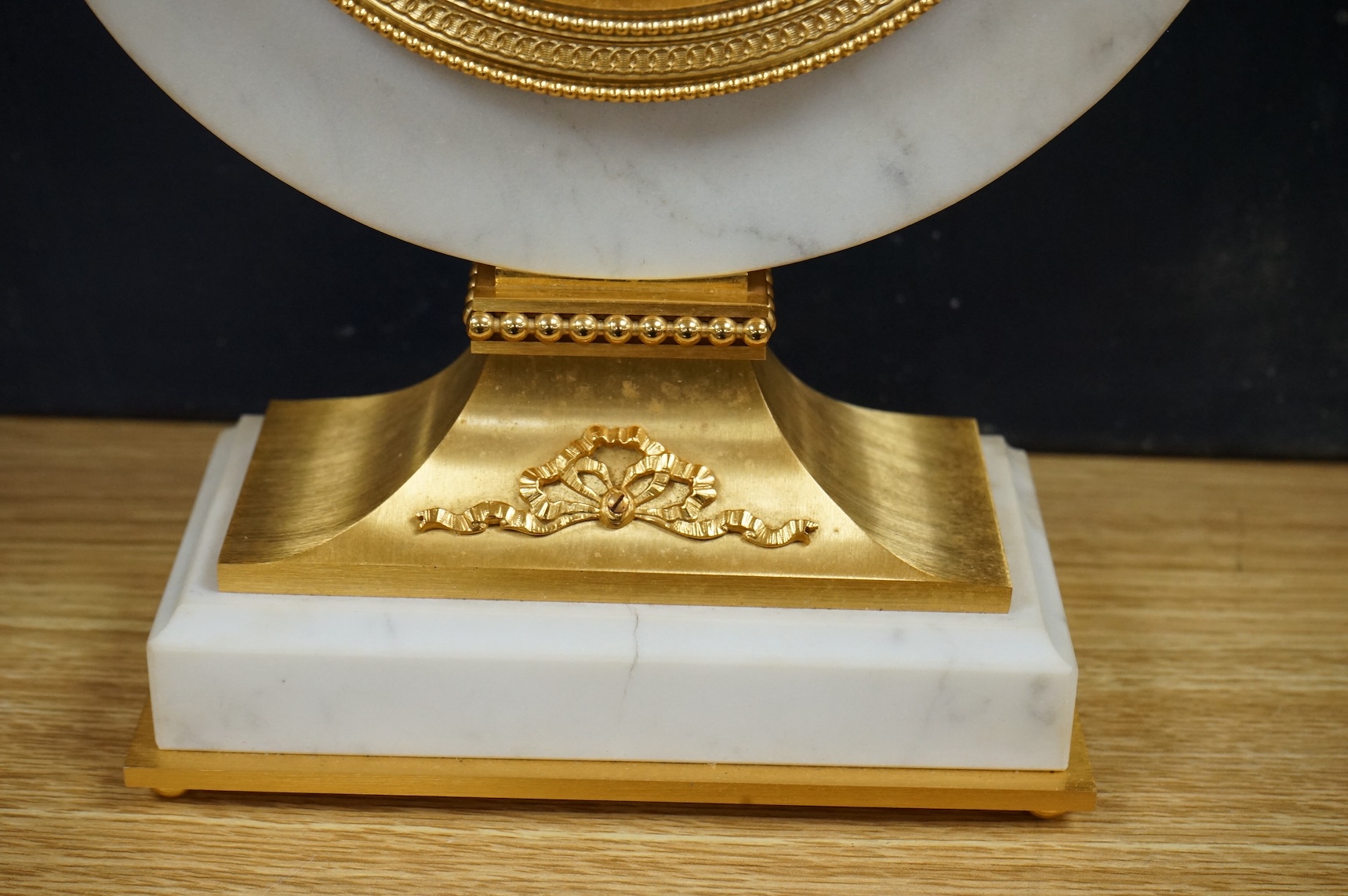 A 1970's Hour Lavigne white marble and gilt bronze mantle timepiece, boxed, 29cm high